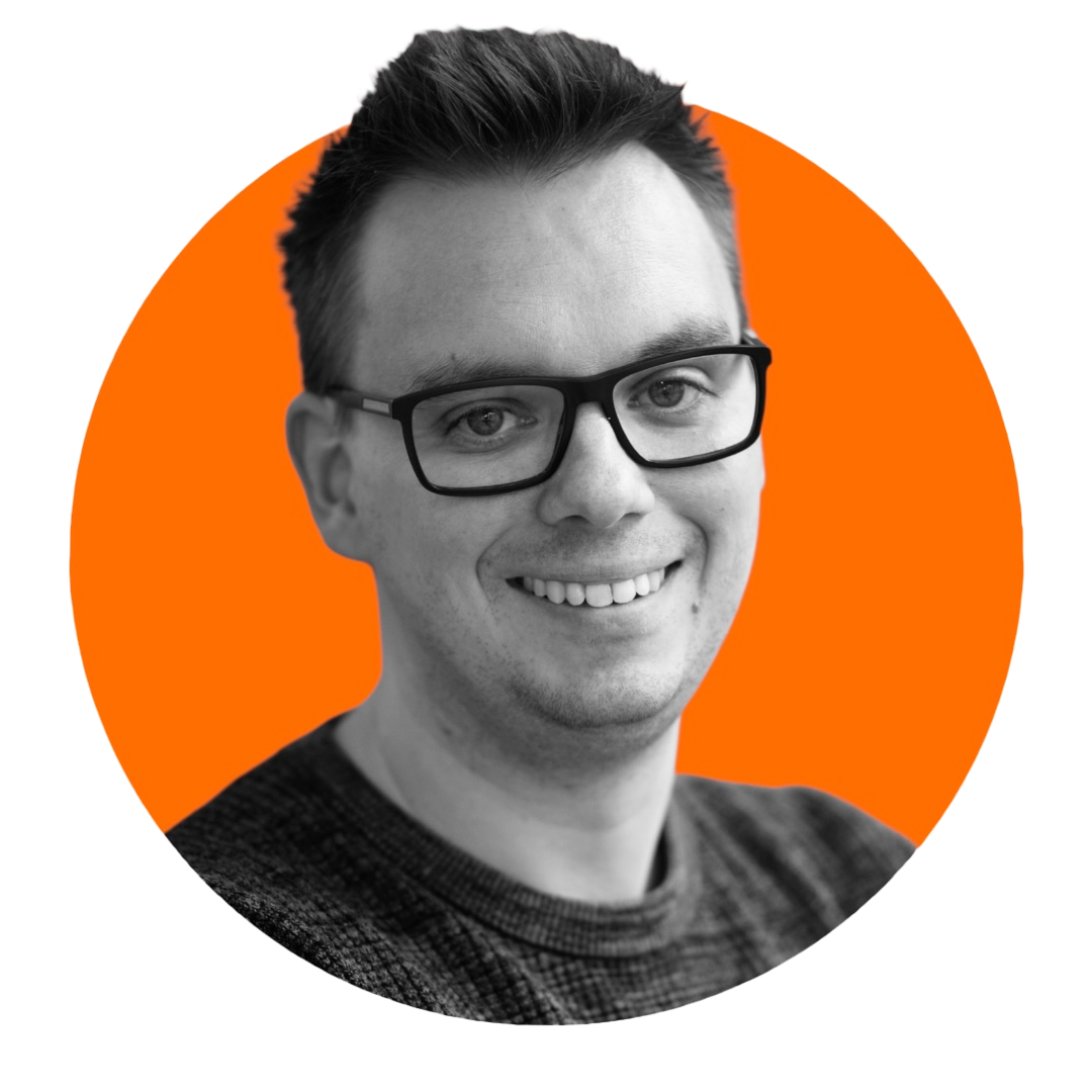 Smiling person with glasses, orange background