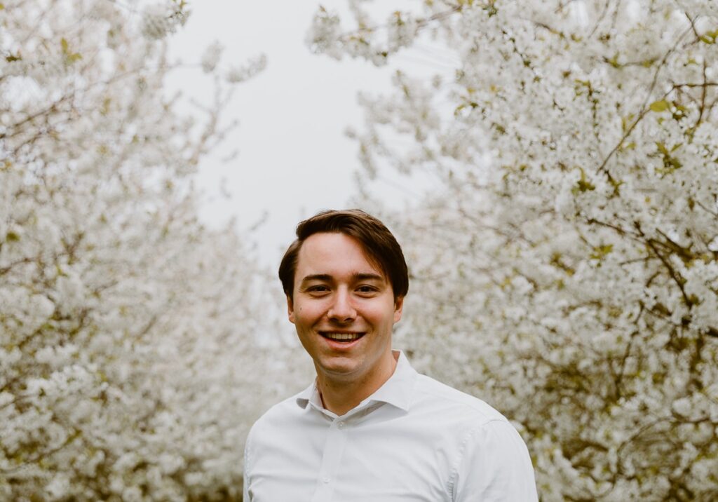 Man in the midst of blossom trees