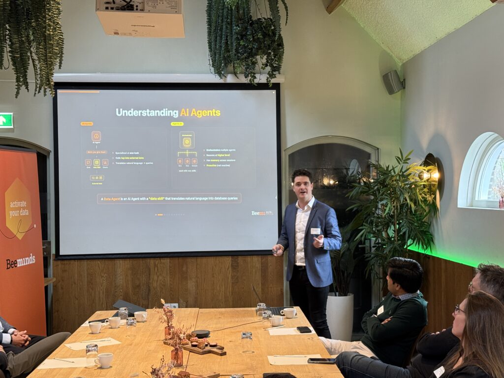 man gives presentation in front of a screen