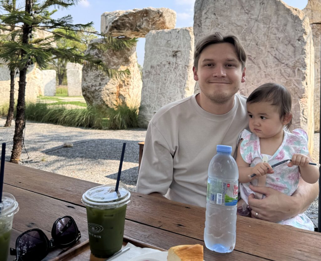man with daughter and a bottle of water
